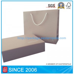 Cuir bosca páipéir agus mála páipéir ar éadaí do leanaí