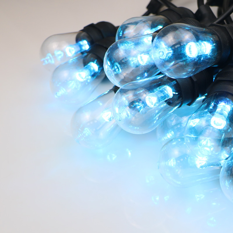 Bolgáin téad allamuigh dath bán te le solas na maisiúcháin Nollag a roghnú