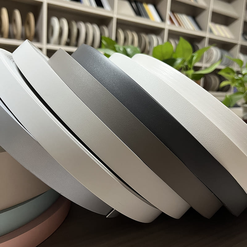 Troscán gráin adhmaid PVC imeall bandáil liath